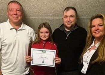 Alice Hall with Plassey junior organiser Glenn Carney, dad Ian, and Plassey owner Sarah Brookshaw.