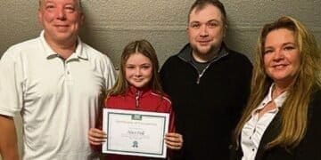 Alice Hall with Plassey junior organiser Glenn Carney, dad Ian, and Plassey owner Sarah Brookshaw.