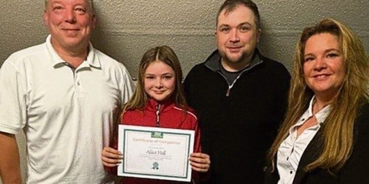 Alice Hall with Plassey junior organiser Glenn Carney, dad Ian, and Plassey owner Sarah Brookshaw.