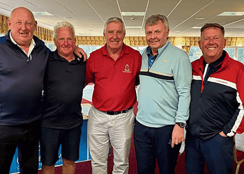 Helsby captain Mike Branigan with the winning team.