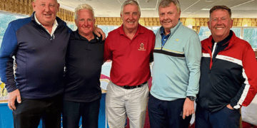 Helsby captain Mike Branigan with the winning team.