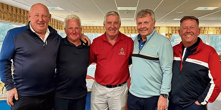 Helsby captain Mike Branigan with the winning team.