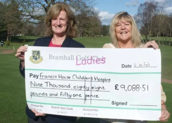 Bramhall Golf Club’s past lady captain, Jo Lingwood, presents a cheque for over £9,000 to Francis House Charity.
