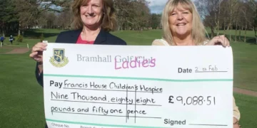 Bramhall Golf Club’s past lady captain, Jo Lingwood, presents a cheque for over £9,000 to Francis House Charity.