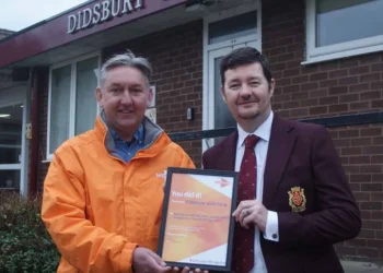 David being presented with his framed certificate by Andy.