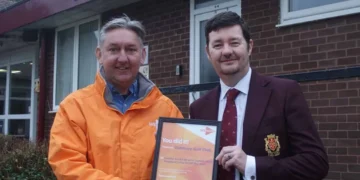 David being presented with his framed certificate by Andy.