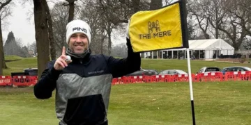 Jon poses after his grand slam ace.