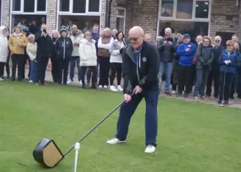 Bramhall Golf Club captain Stephen Sheard prepares for his drive-in ceremony with a large show driver.