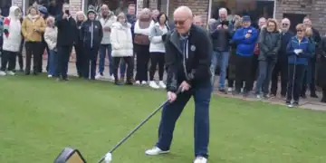 Bramhall Golf Club captain Stephen Sheard prepares for his drive-in ceremony with a large show driver.