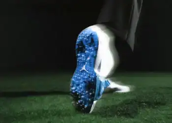 Golfer wearing the Jordan Brand Air Rev shoes, demonstrating stability and style on the golf course with matching apparel.