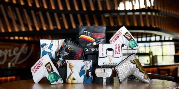 Bettinardi Golf & Guinness accessories on a table.