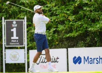 a man swinging a golf club