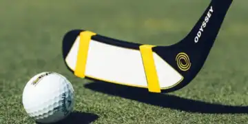 a golf club and a golf ball
