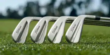 a group of golf clubs on grass