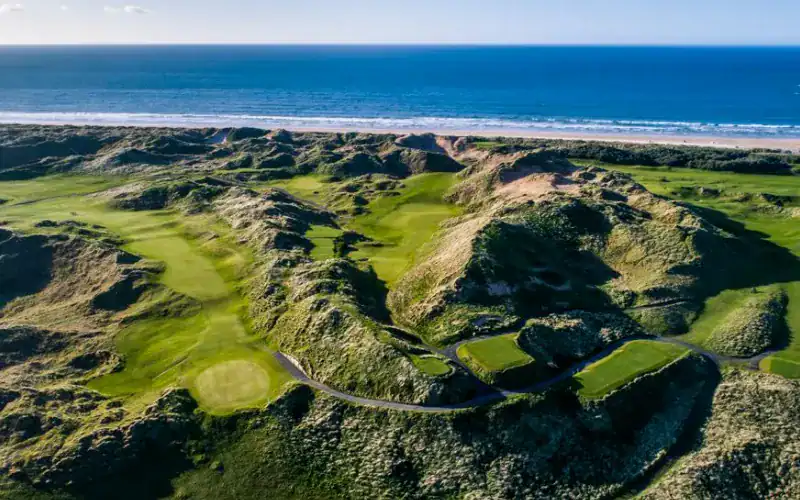 A golf course on a beach.