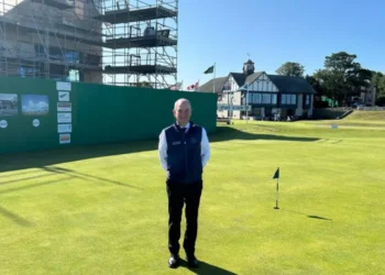 a man standing on a golf course
