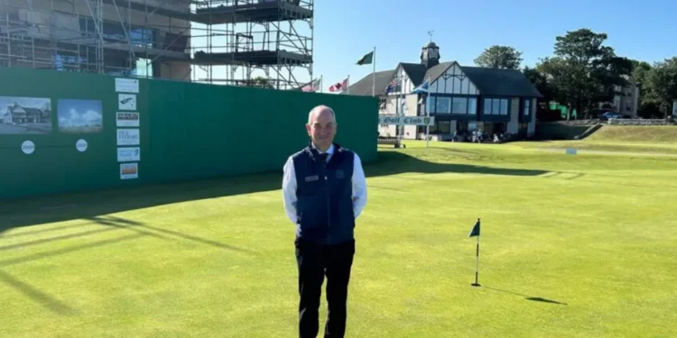 a man standing on a golf course