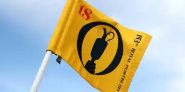 a yellow flag with a black and red design on it