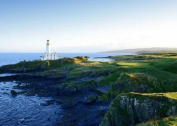 a lighthouse on a rocky island