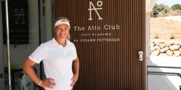 a woman standing in front of a door