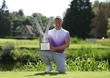 a man holding a trophy