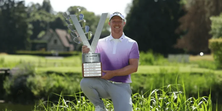 a man holding a trophy