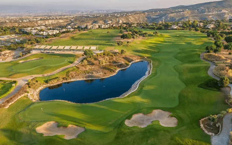 a golf course with a lake