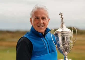 a man holding a trophy