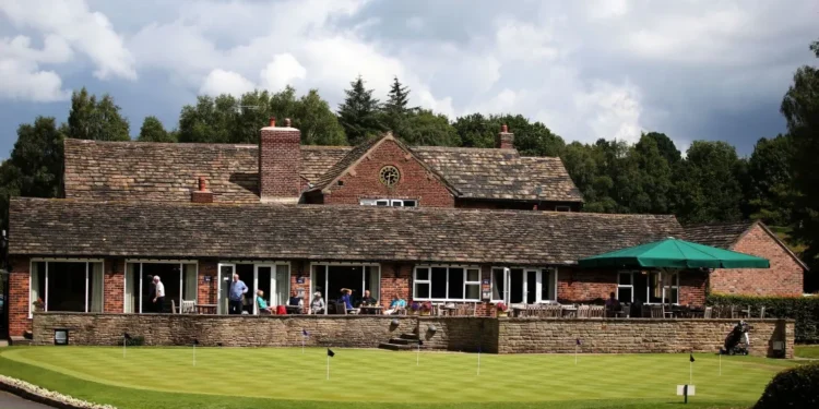 a building with people sitting on the porch