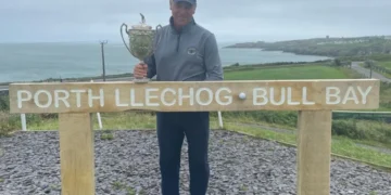 a man holding a trophy