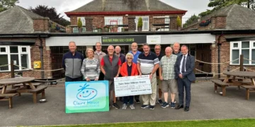 Group photo supporting children's hospice charity.