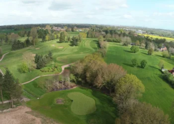 Lush green golf course landscape aerial view.