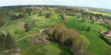 Lush green golf course landscape aerial view.