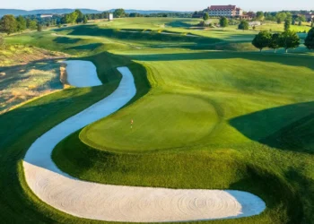 Nemacolin Enters Golf Digest’s Top 15 Best Golf Resorts List Lush golf course with winding fairways.