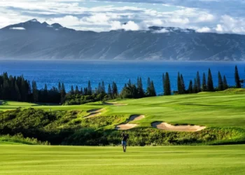 Kapalua Plantation Course Opens After Closure Lush golf course with ocean backdrop