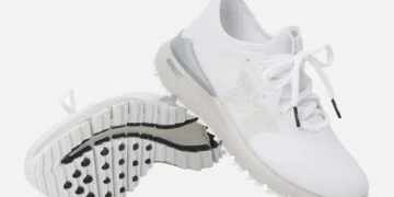 Stylish white golf shoes with traction.