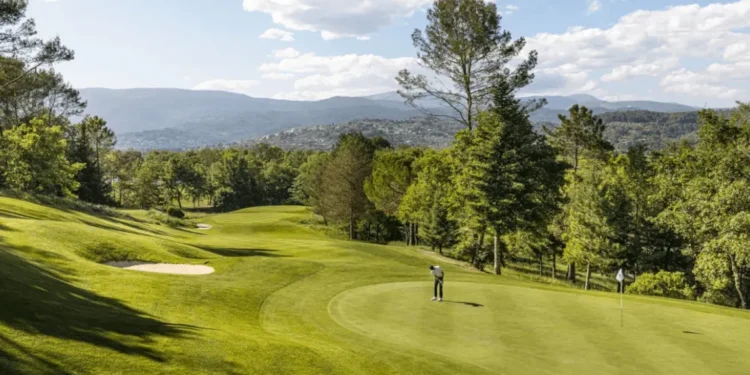 Lush golf course under blue skies.
