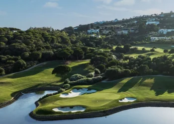 Lush golf course with scenic landscape.