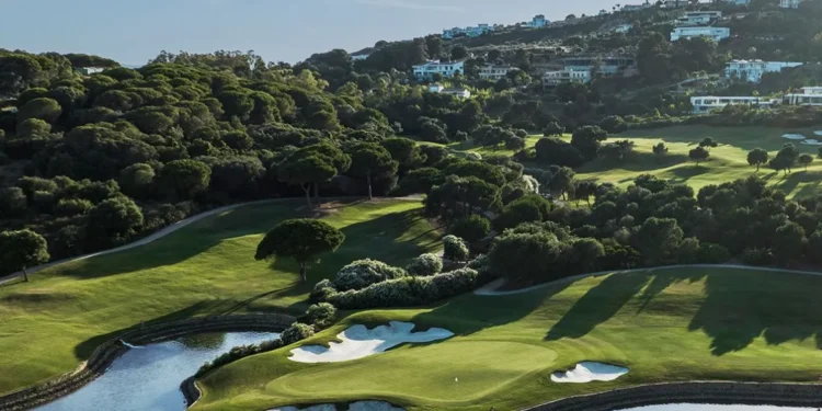 Lush golf course with scenic landscape.