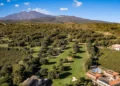 Panoramic view of Picciolo Etna Golf Resort featuring the championship course with Mount Etna in the background.